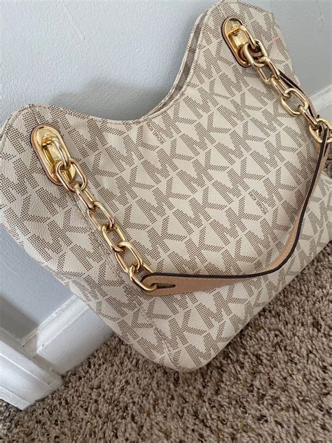 how to tell if a michael kors handbag is real|authenticate michael kors bag.